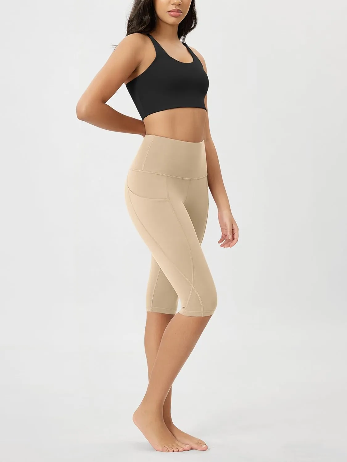 ODODOS Women's High Waisted Yoga Capris with Pockets, Tummy Control Non See Through Workout Athletic Running Capri Leggings