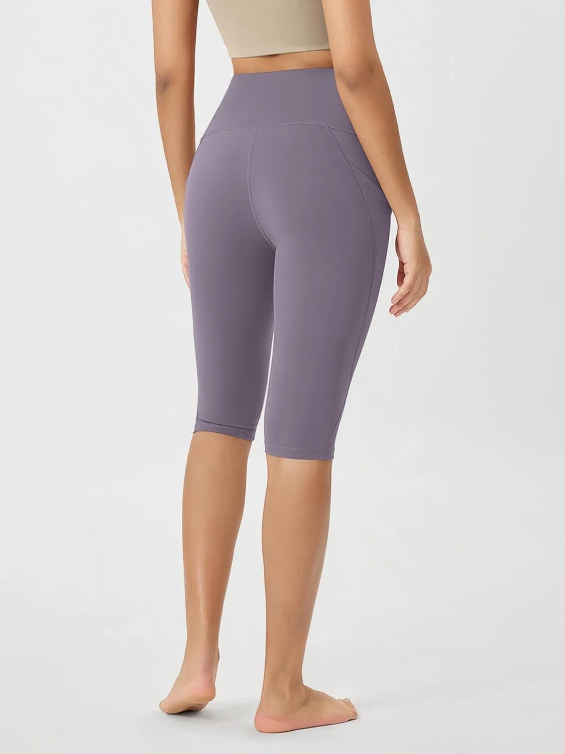 ODODOS Women's High Waisted Yoga Capris with Pockets, Tummy Control Non See Through Workout Athletic Running Capri Leggings