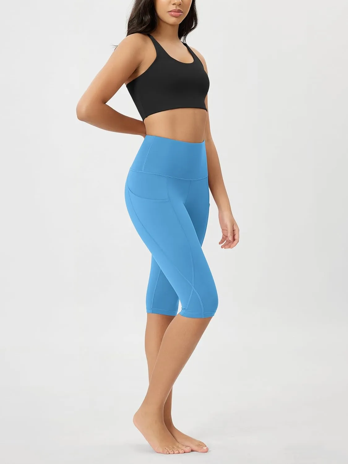 ODODOS Women's High Waisted Yoga Capris with Pockets, Tummy Control Non See Through Workout Athletic Running Capri Leggings